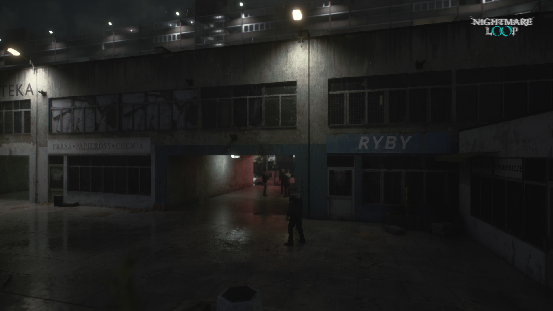 Rainy night view of the Falowiec ground-floor shops with Polish signage