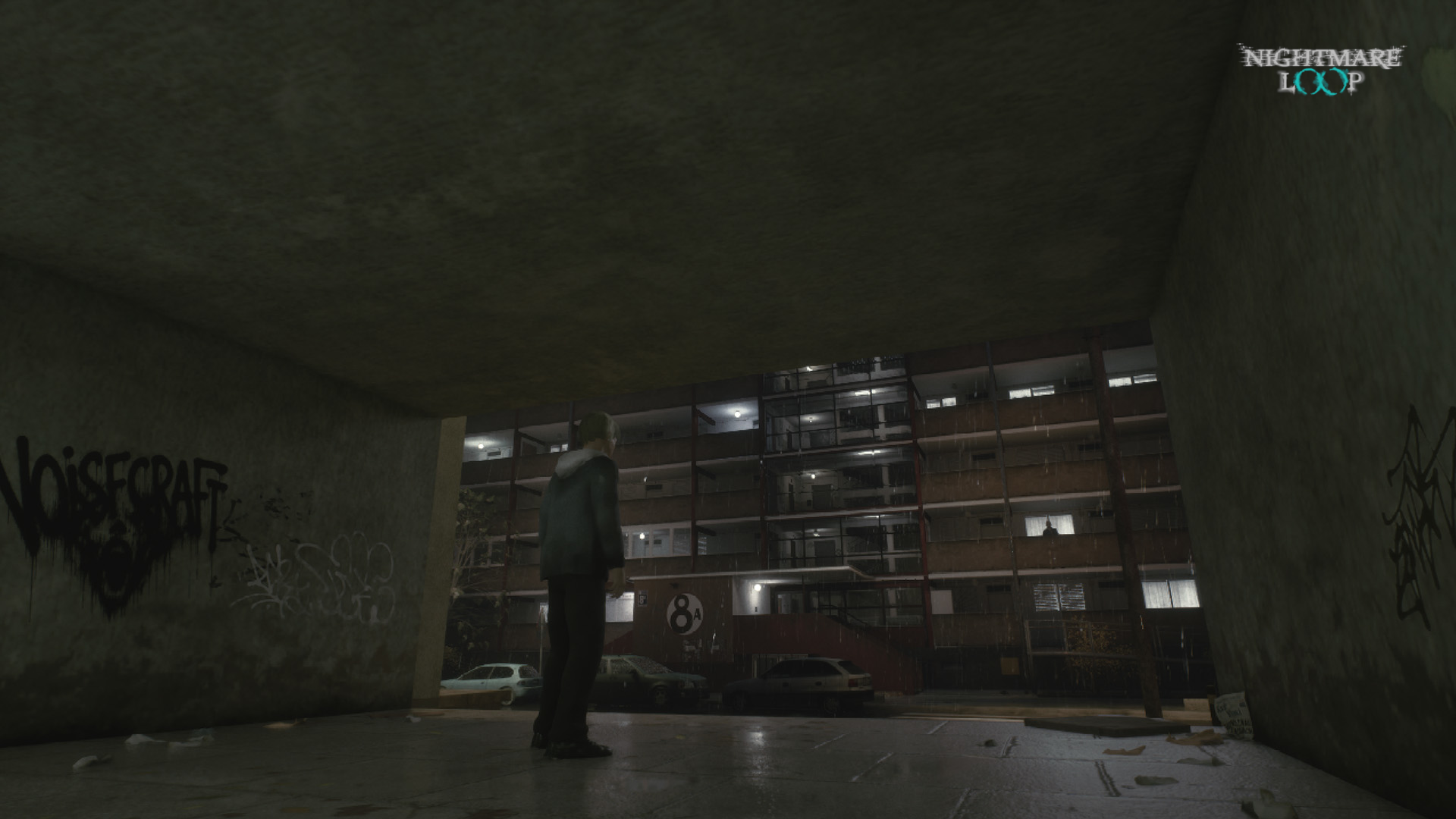 Figure standing in a graffiti-covered underpass facing the lit Falowiec block