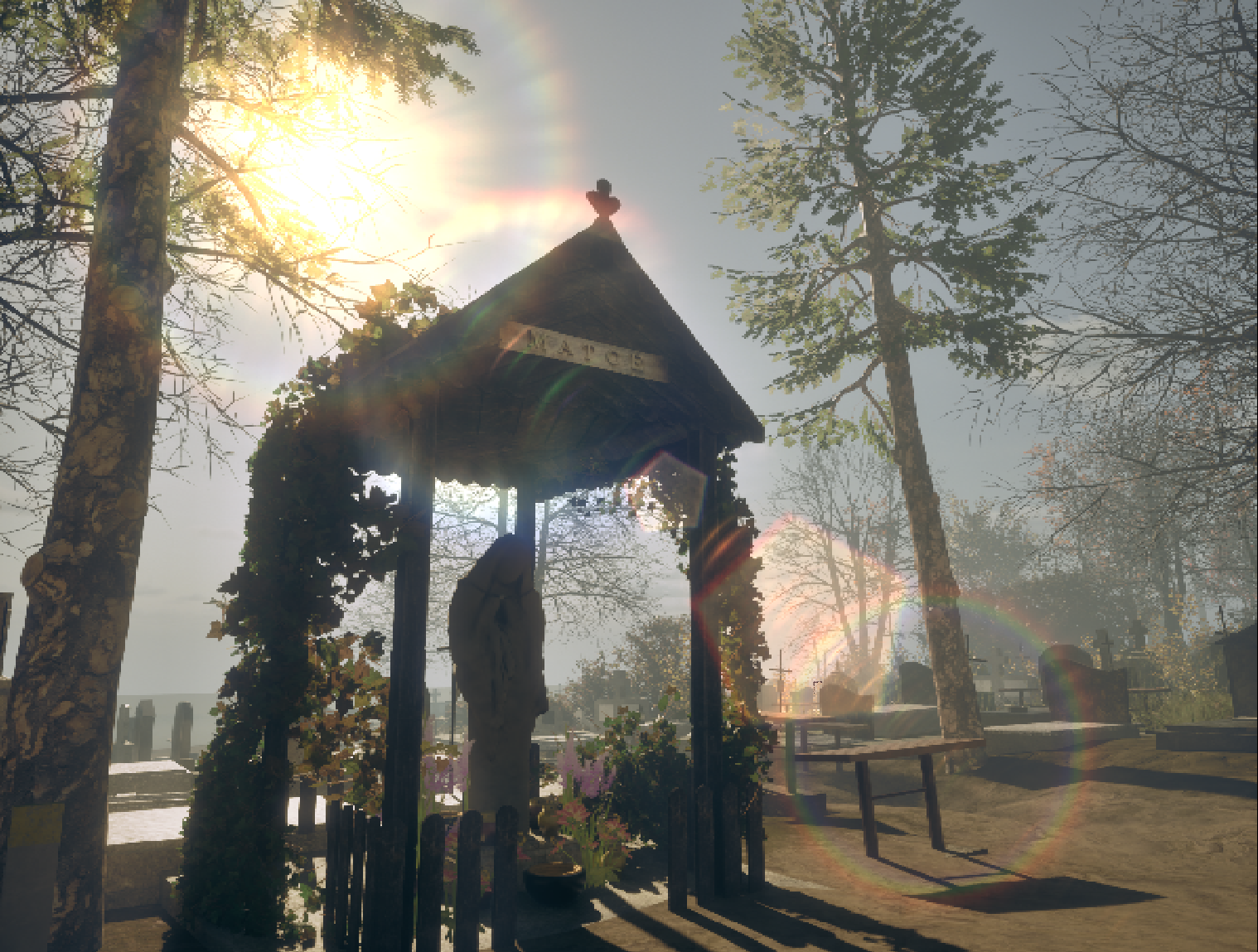 Shrine in cemetery with sun flare